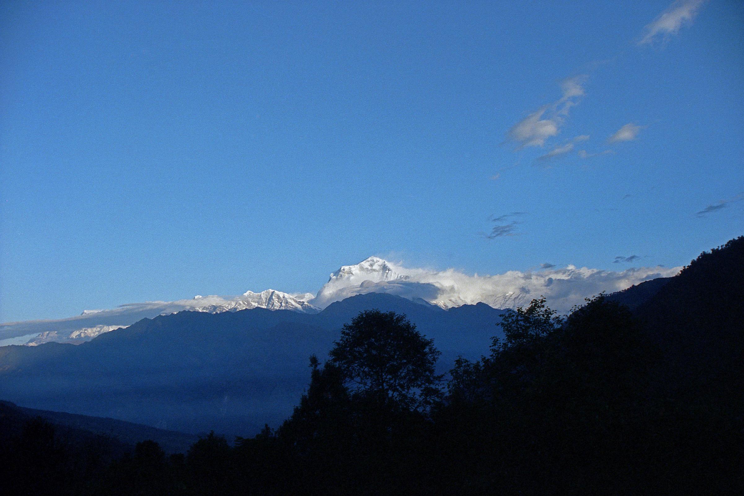 601 Dhaulagiri Sunrise From Chitre I had a great view of sunrise on Dhaulagiri from the dining room window at the New Dhaulagiri Hotel in Chitre (2420m). This view is basically the same as that from the famous Poon Hill.